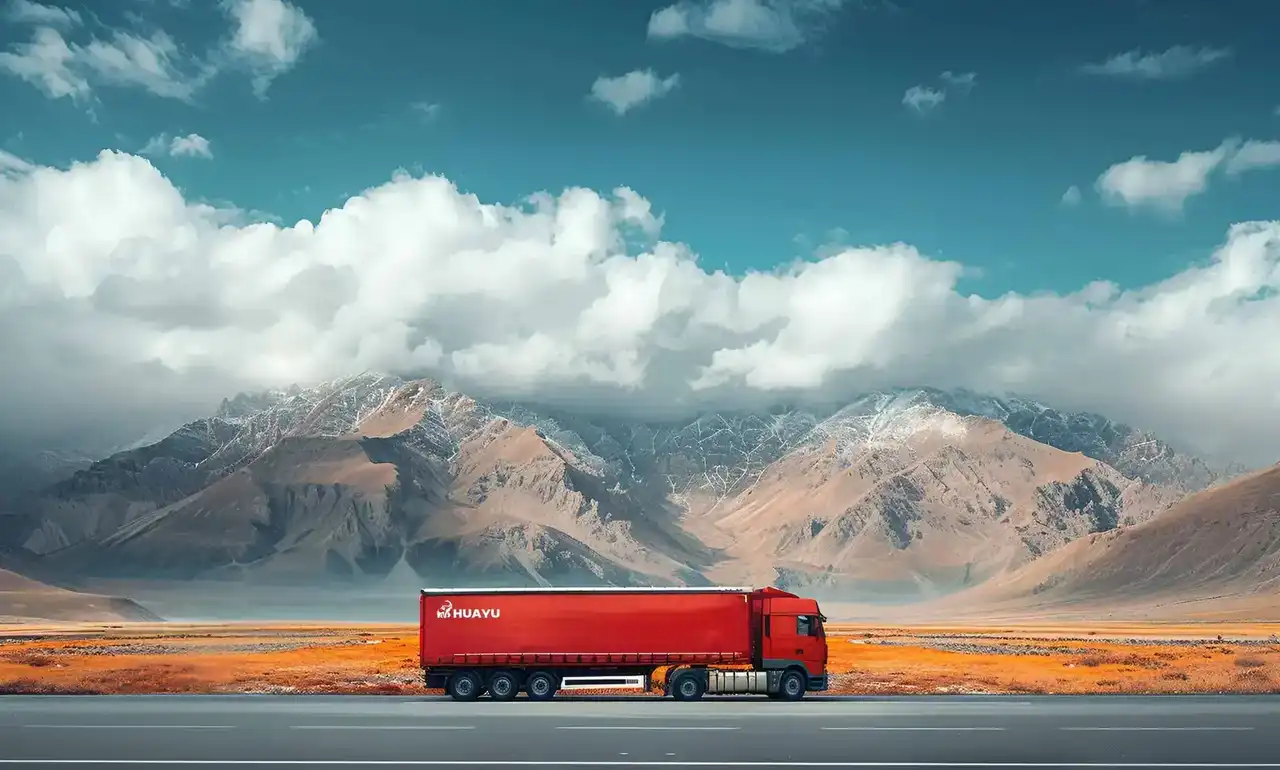 HUAYU semi trailer on highway with mountain backdrop