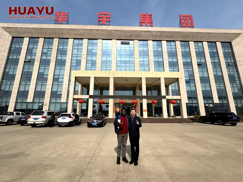 Tanzanian customers viewing lowbed trailers at HUAYU